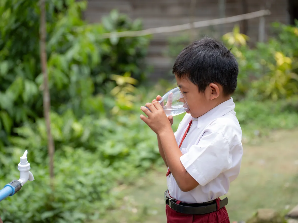 An Indonesian boy drinks safe water