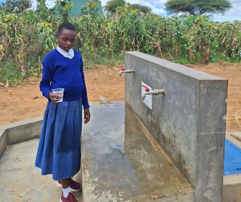 A child in Tanzania at a safe water access point
