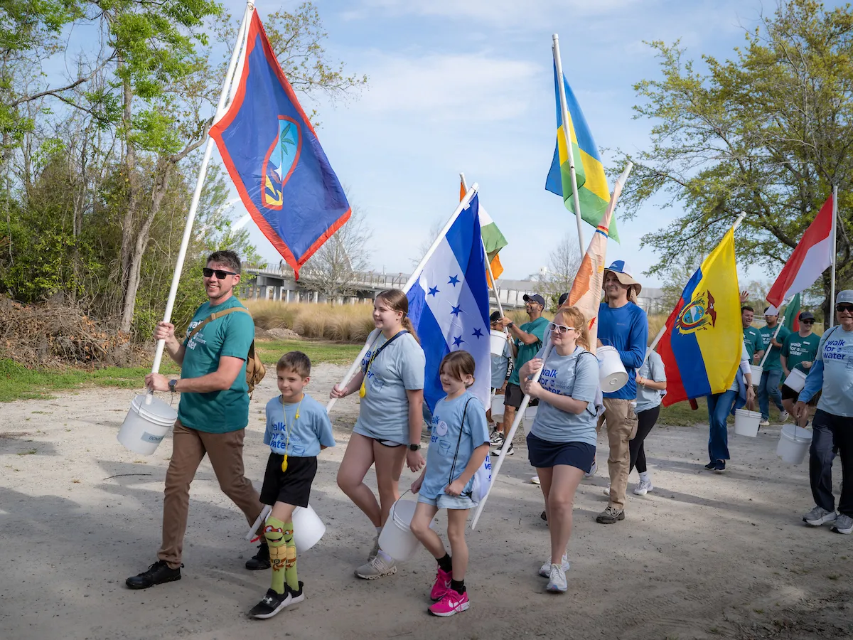 Walkers carry flags