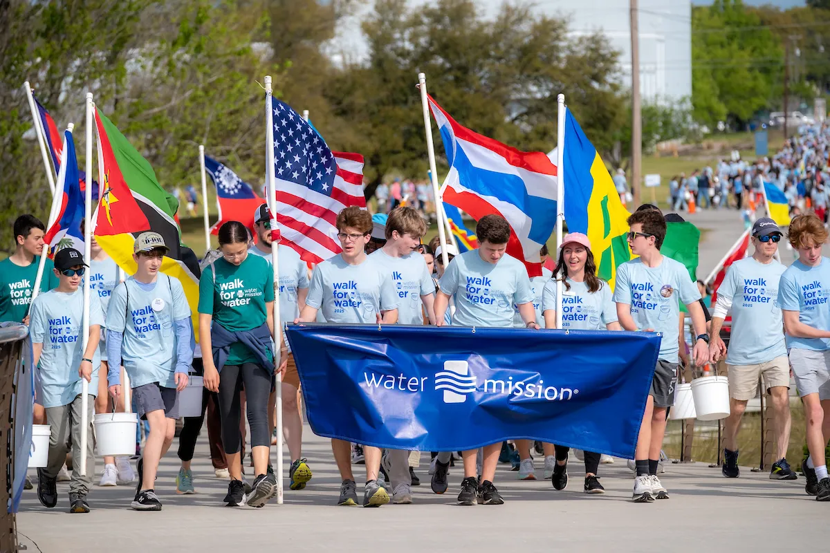 Walkers carry Water Mission banner