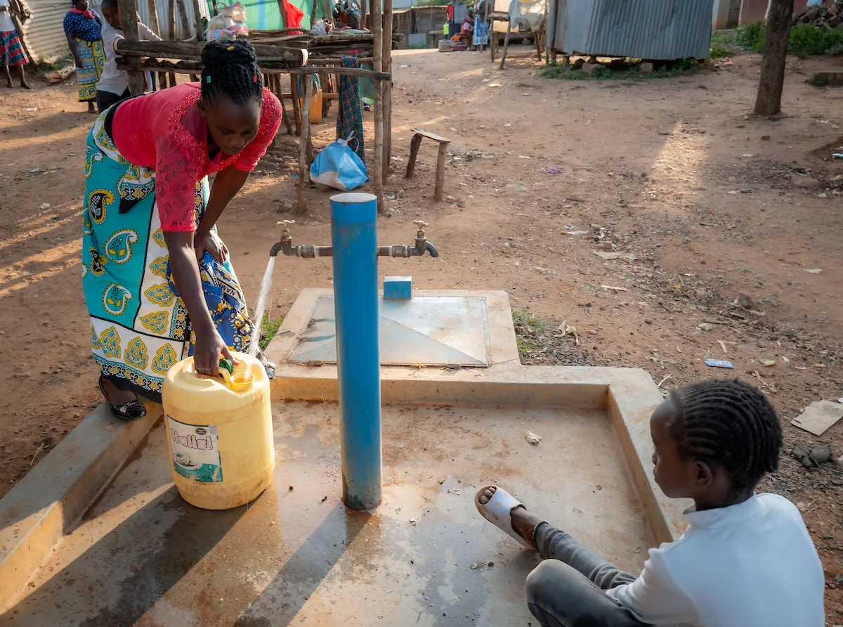 Woman collects water