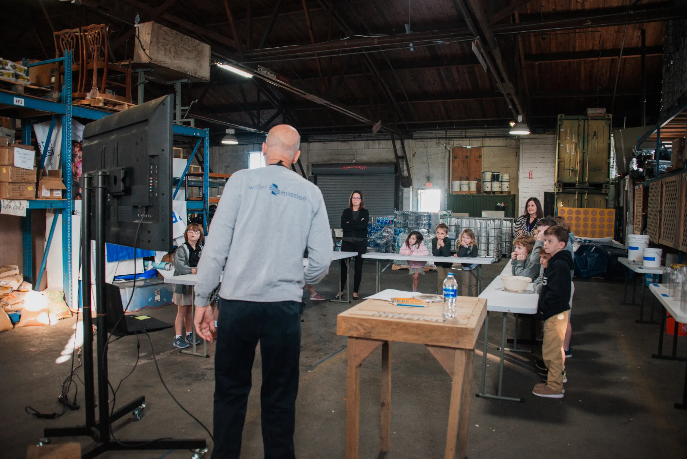 A volunteer in Charleston, SC leads a class for local students