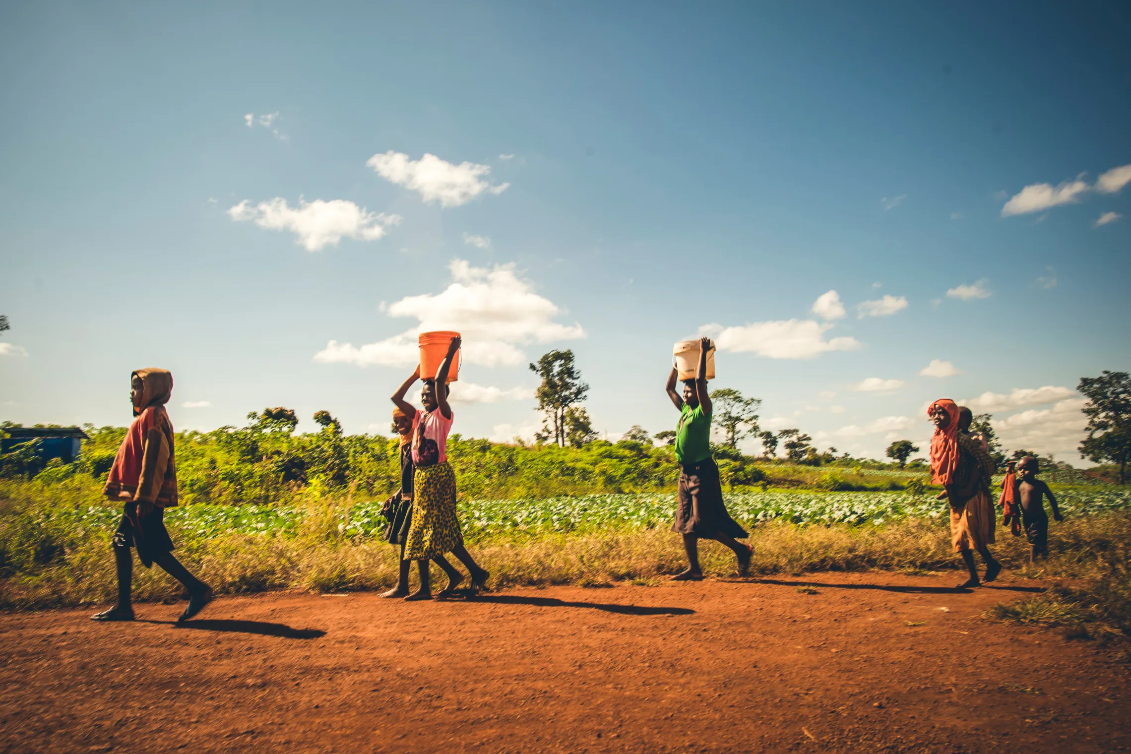 Kids carrying jerry can in Tanzania