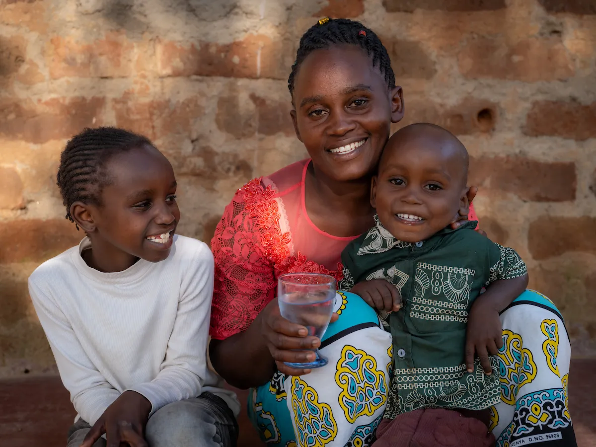 Family of three smiling