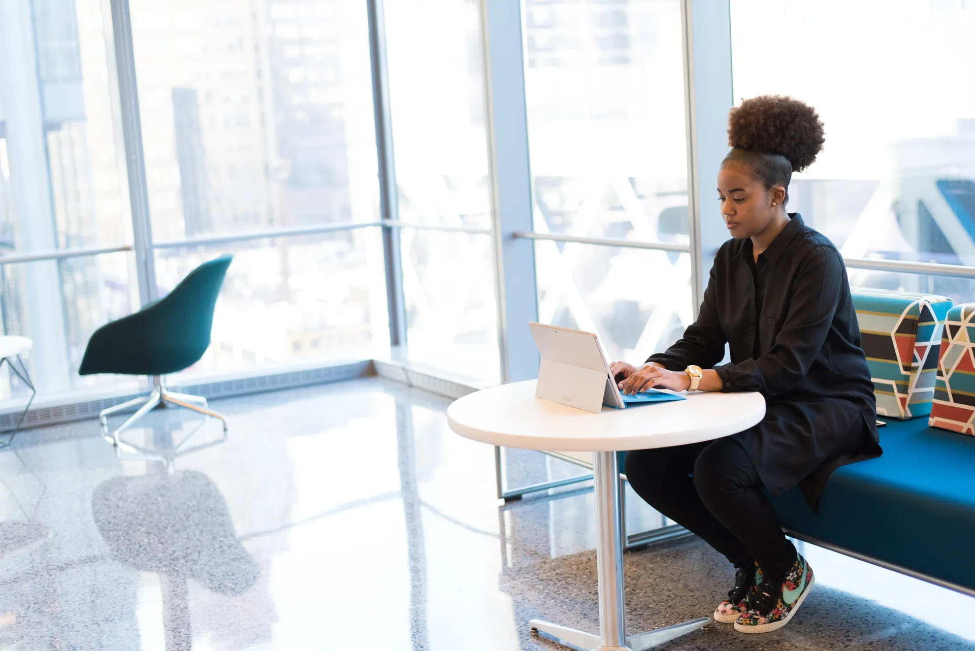 Woman at desk using laptop