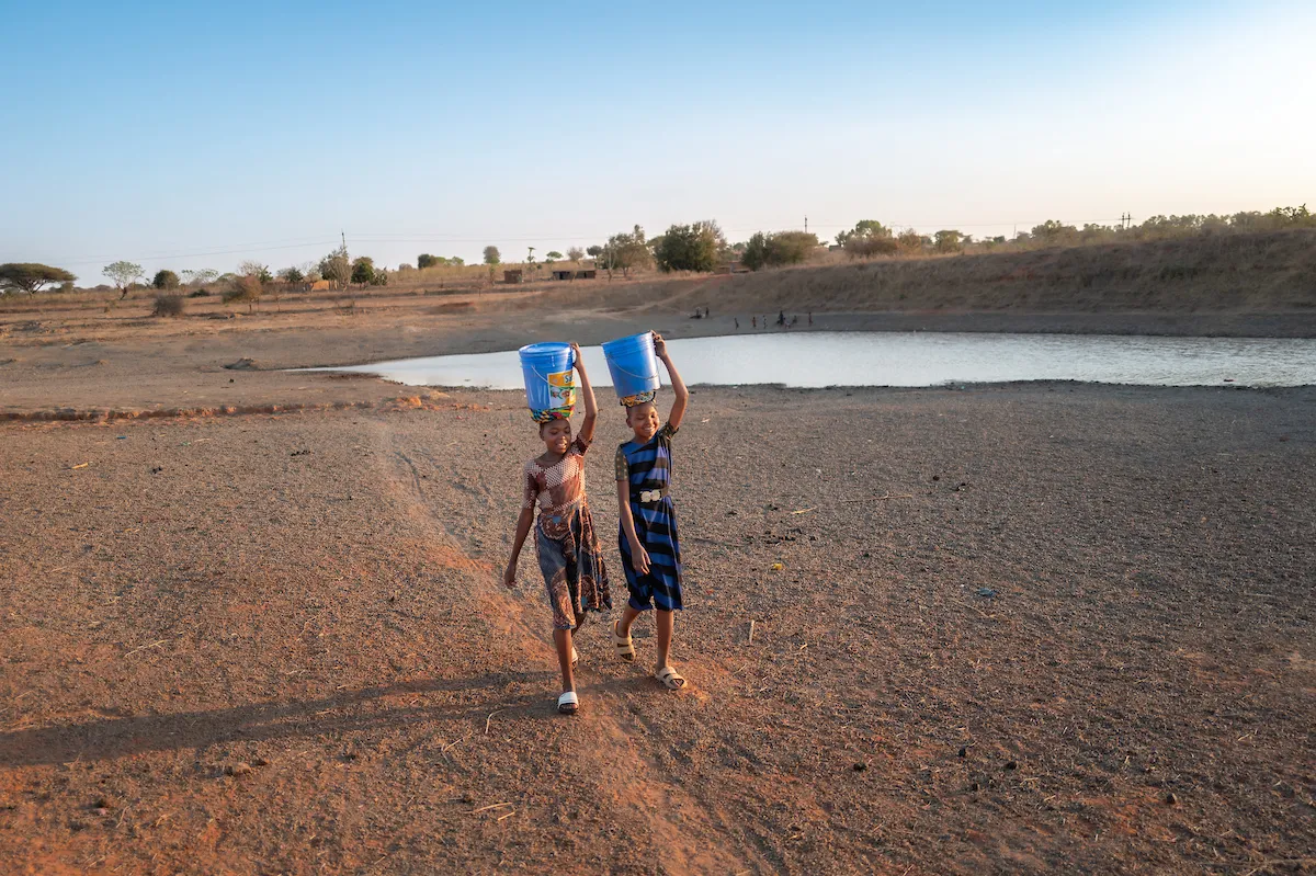 Neema and Recho walk for water in Tanzania, Africa
