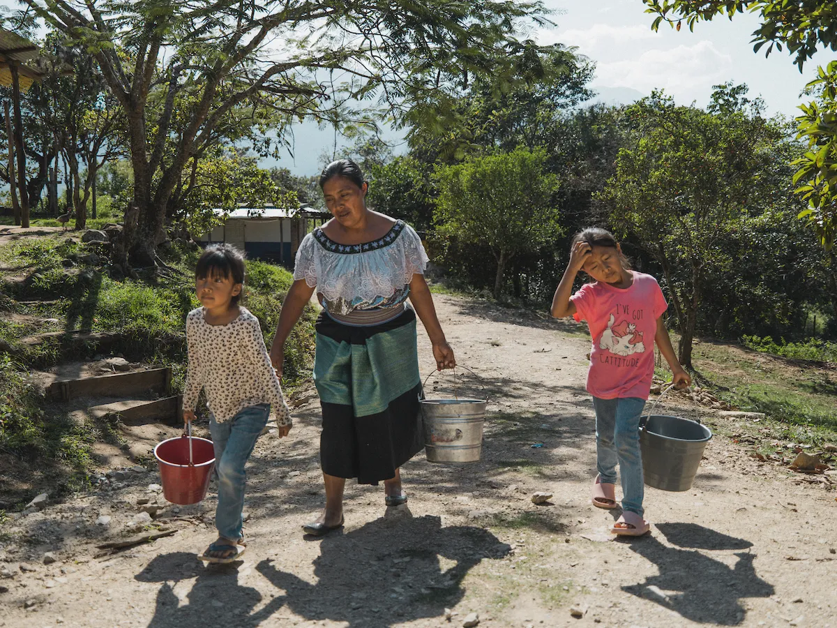 Maria and her children fetch water in Mexico