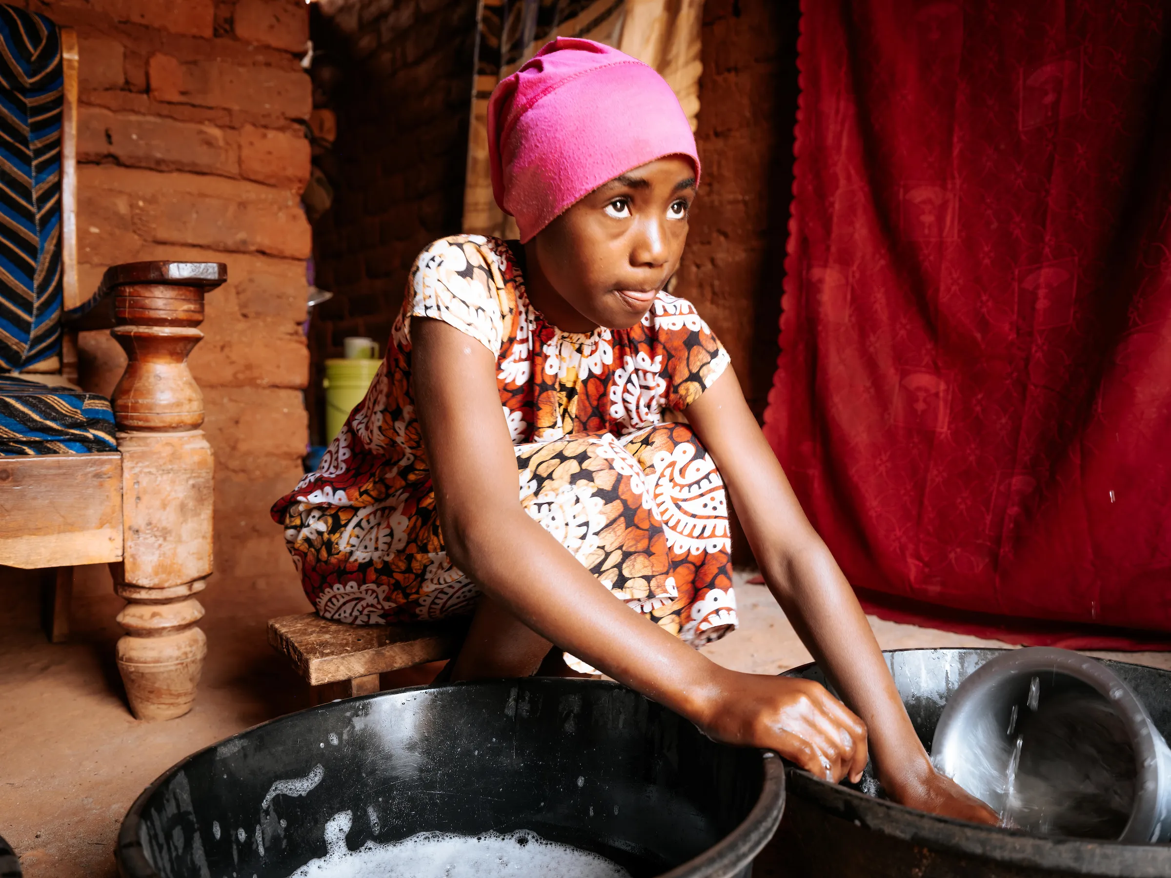 Woman washing pots and pans