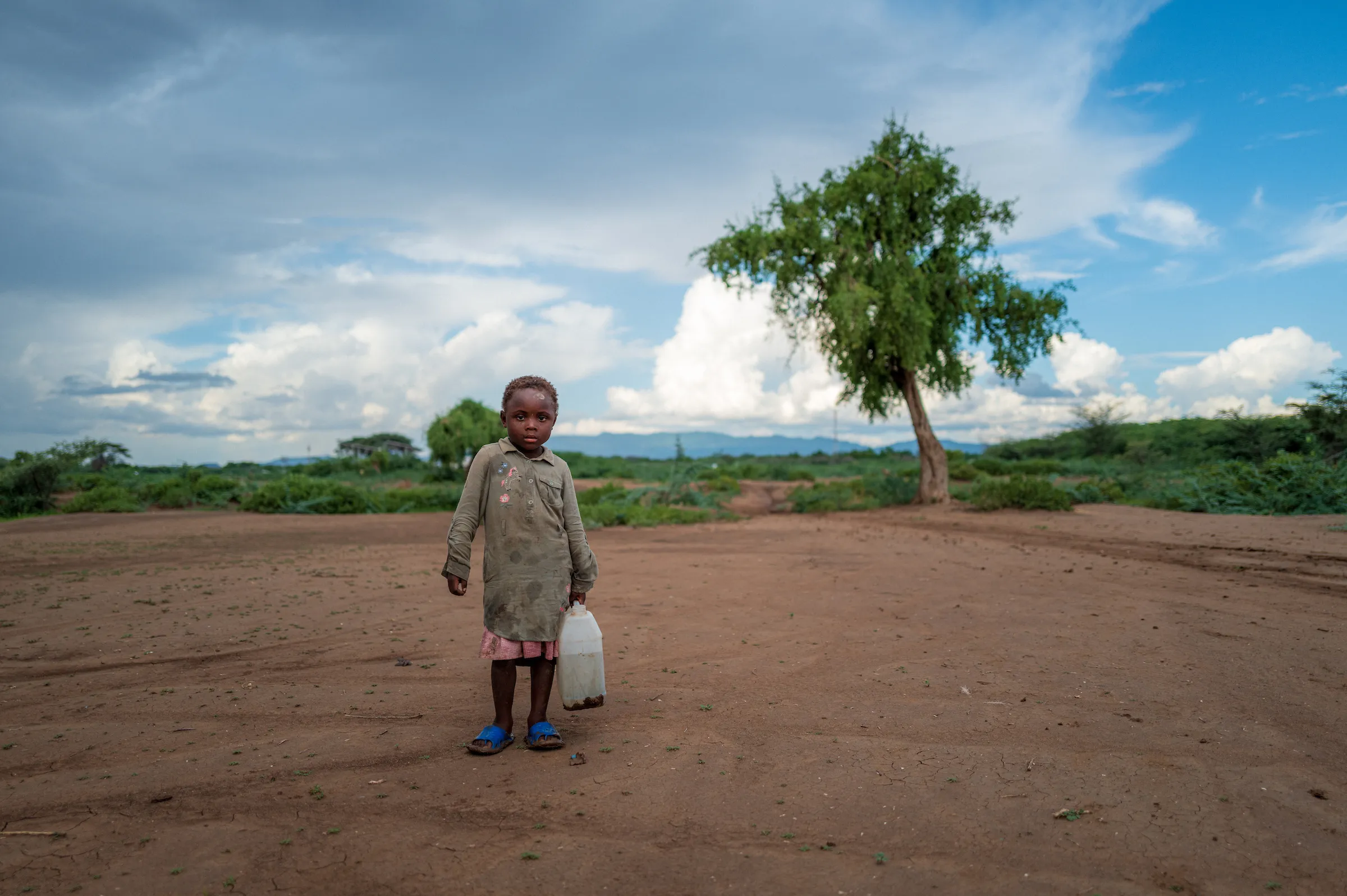 Boy collecting water