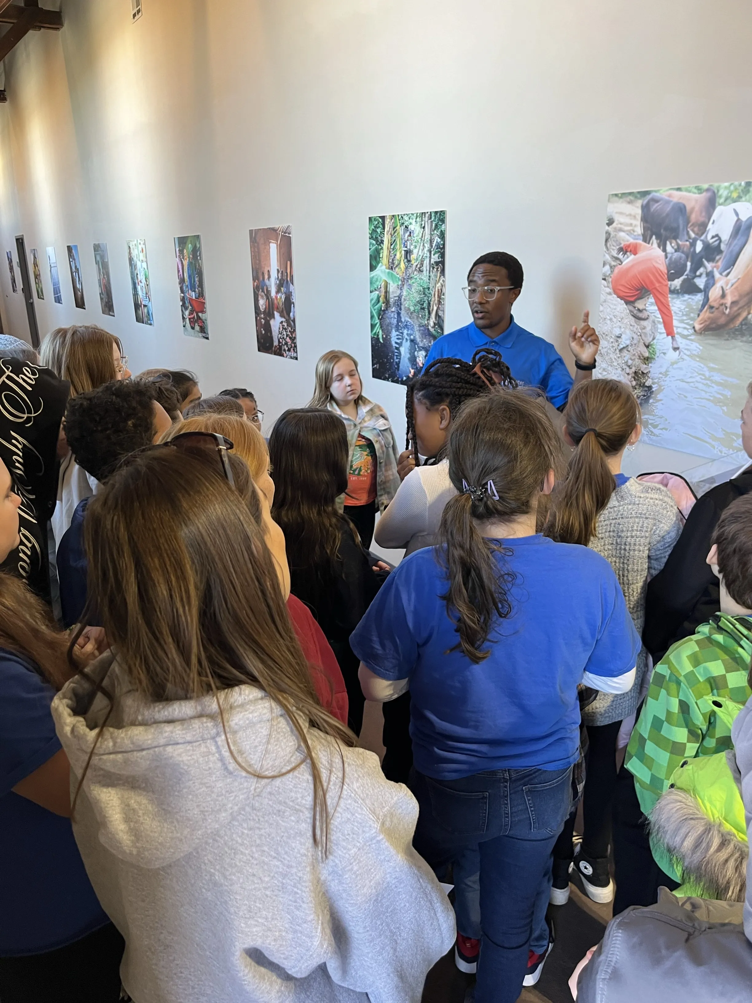 A volunteer leads a tour at Water Mission's global headquarters