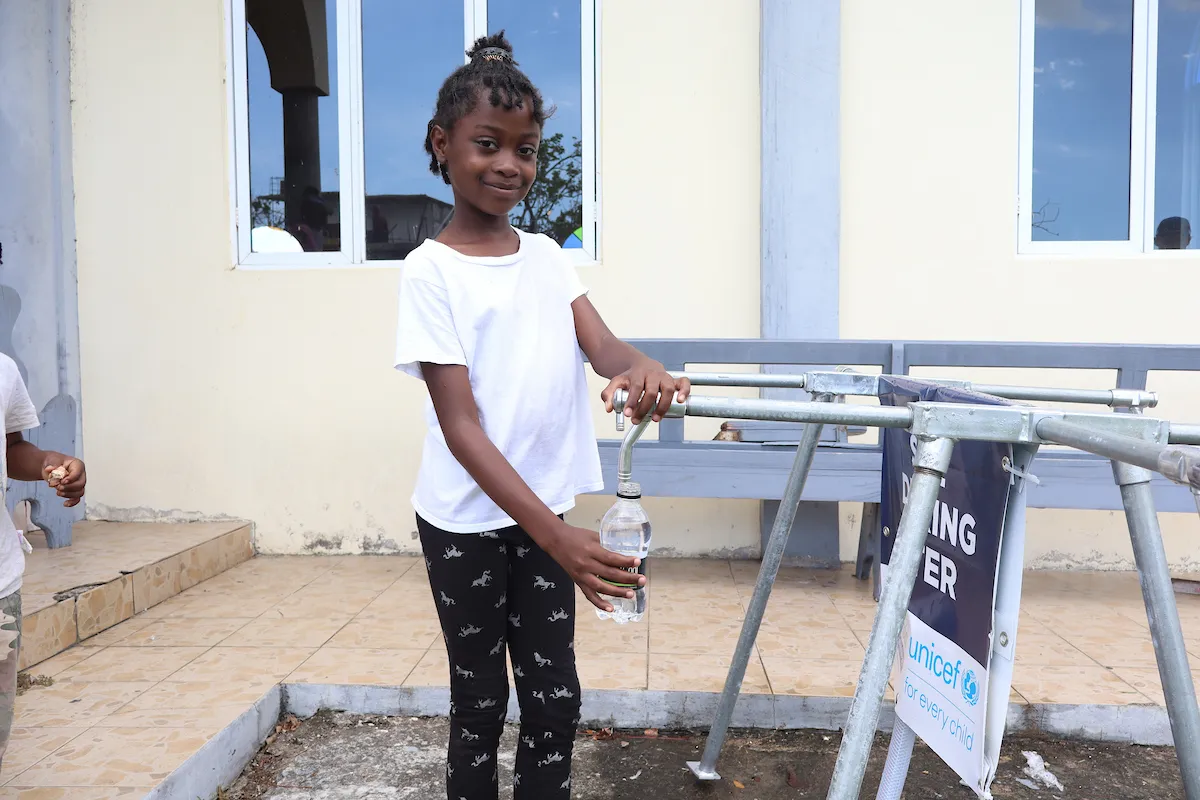 Girl in Jamaica accesses safe water