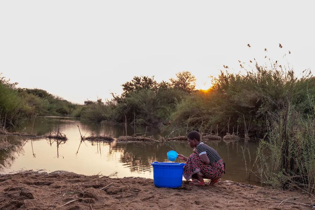 Woman collecting water