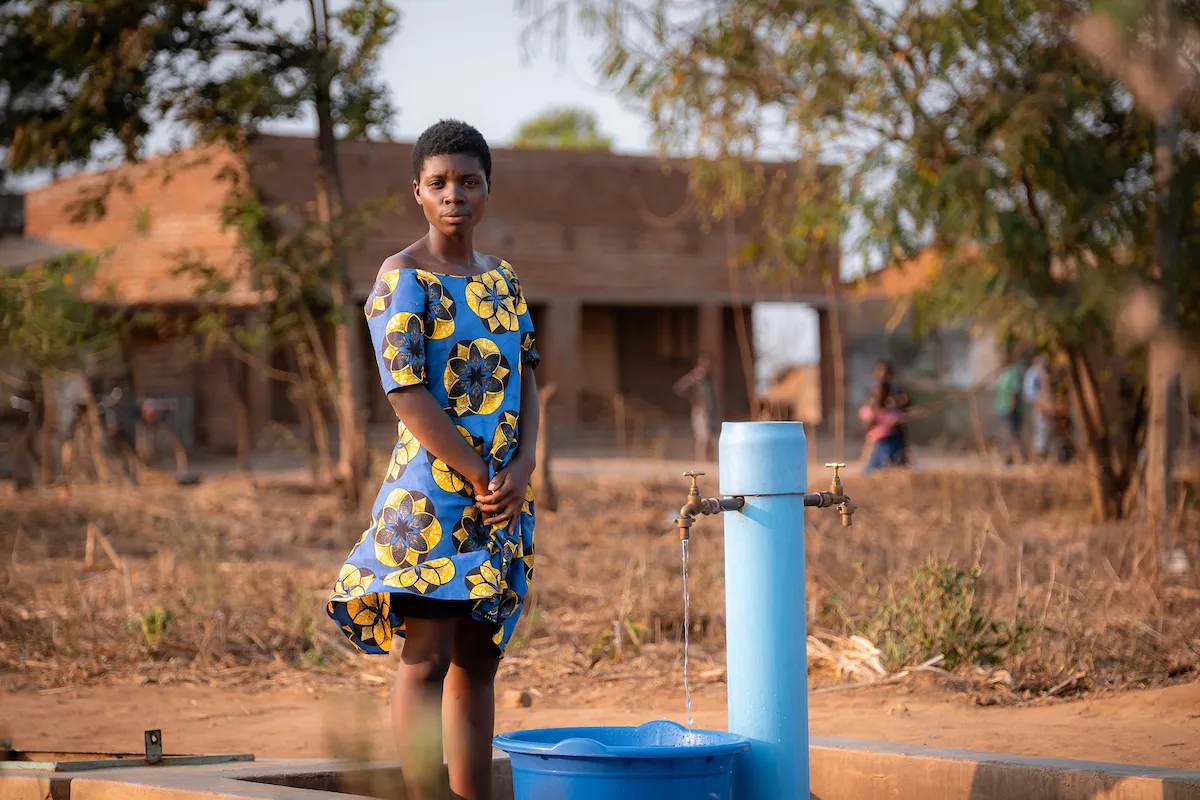 Woman using tap stand