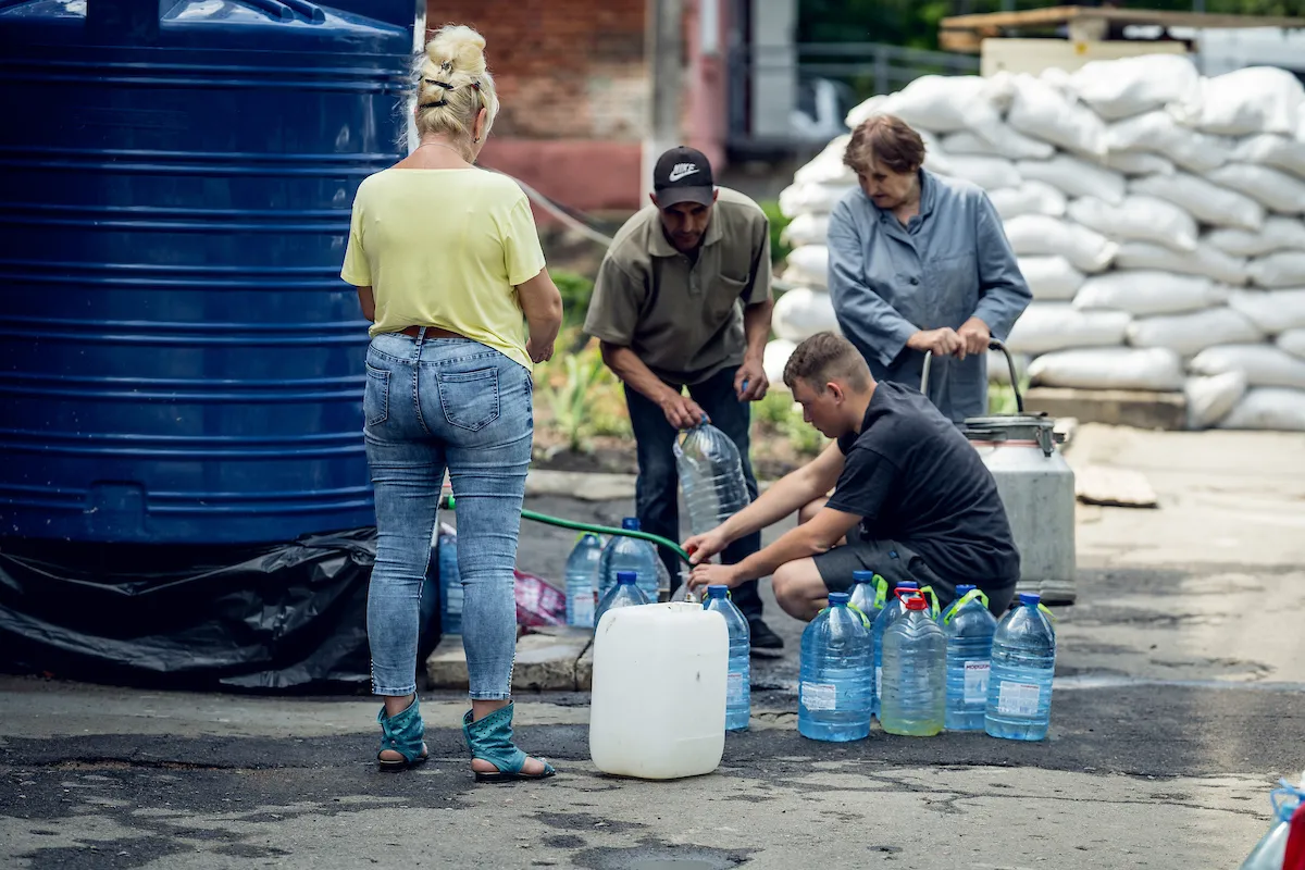 People collecting safe water