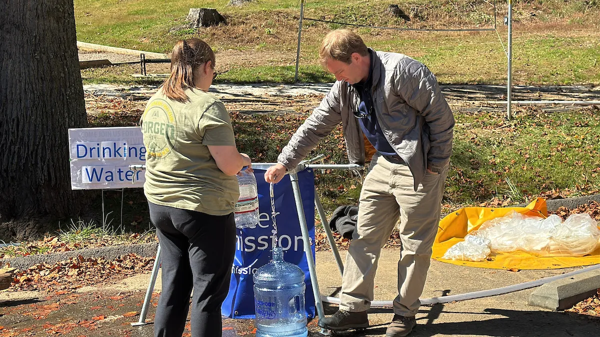 George Greene IV and a safe water beneficiary