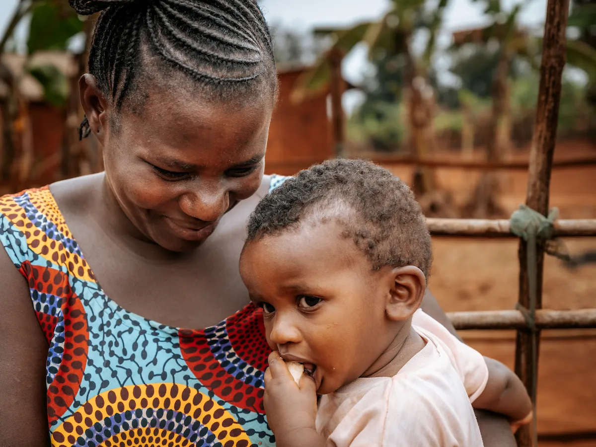 African mother smiling at her baby