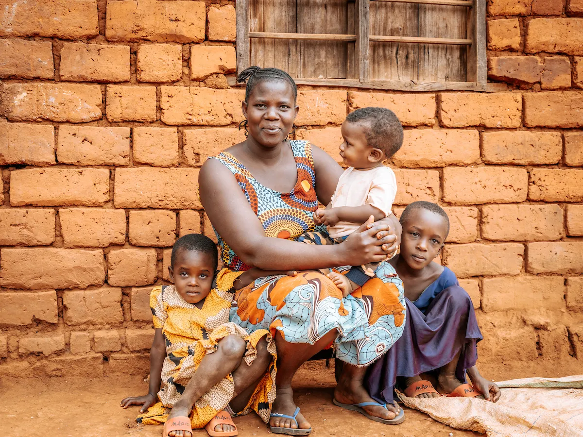 An African mother and three children smiling