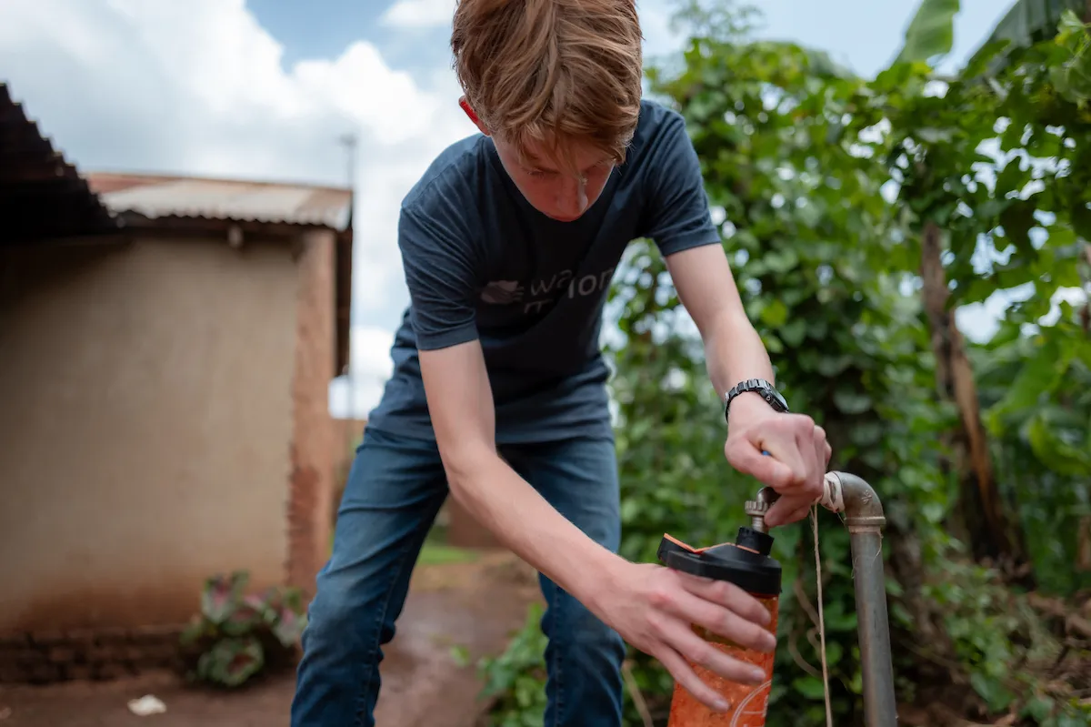 George Greene IV's son Thomas fills his bottle with safe water
