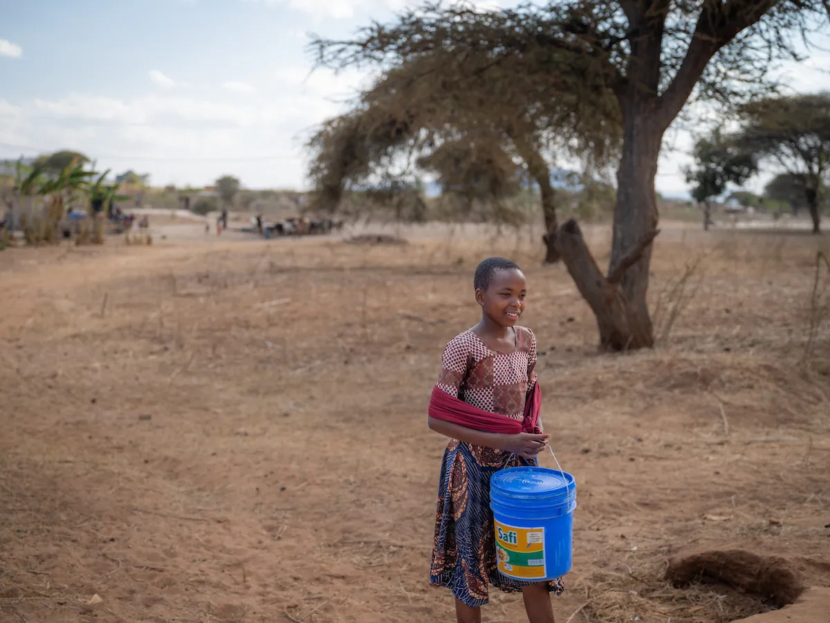 Child in Tanzania, Africa walks for water