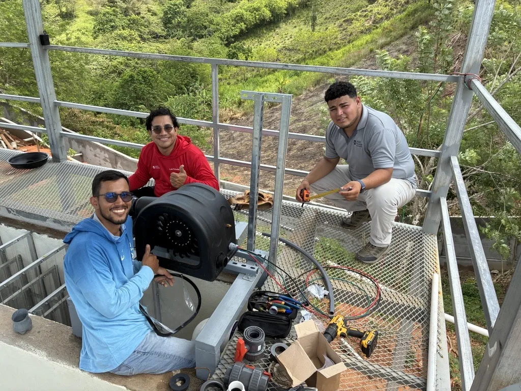 Water Mission staff at a solar-powered safe water project