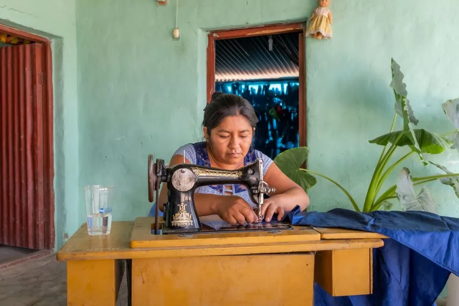 Cipriana, a mother of two, sews clothes for people in her community.