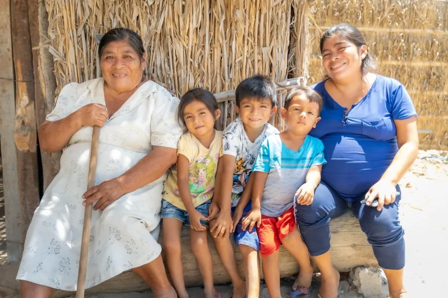 Maria Luciana sits with her daughter, Fabiola, and three of her grandchildren.