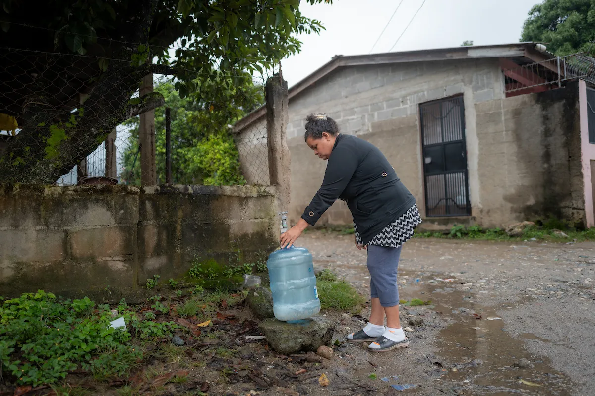 A woman in Honduras accesses safe water