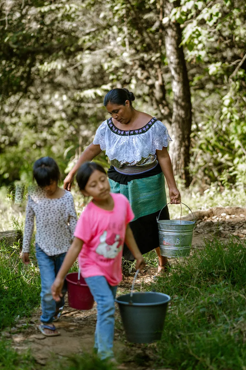 Maria and her children fetch water in Mexico