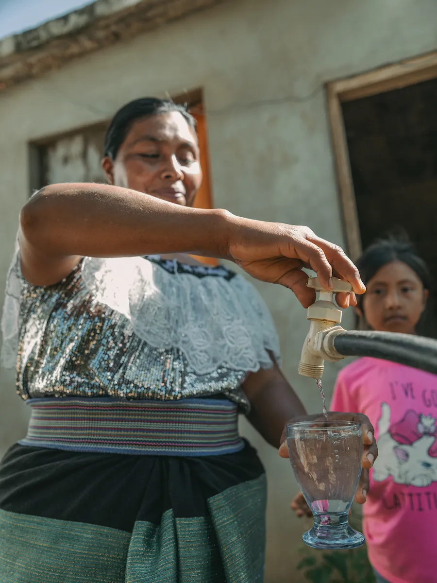 A woman from Mexico at a water tap
