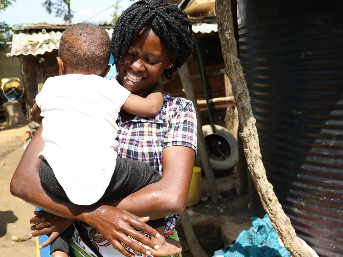 Rose from Kenya, Africa holding her child