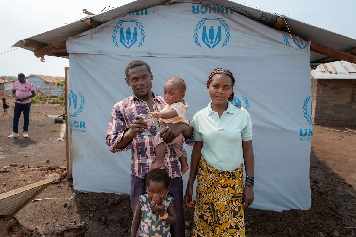 Katembo (right) and her husband Lubungu (left) with three-year-old Sabina and baby Lubungu.