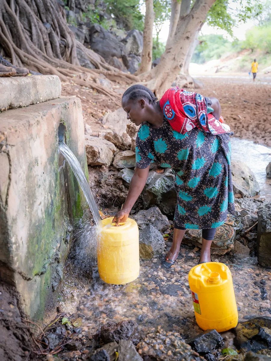 Lucy fills up water jug