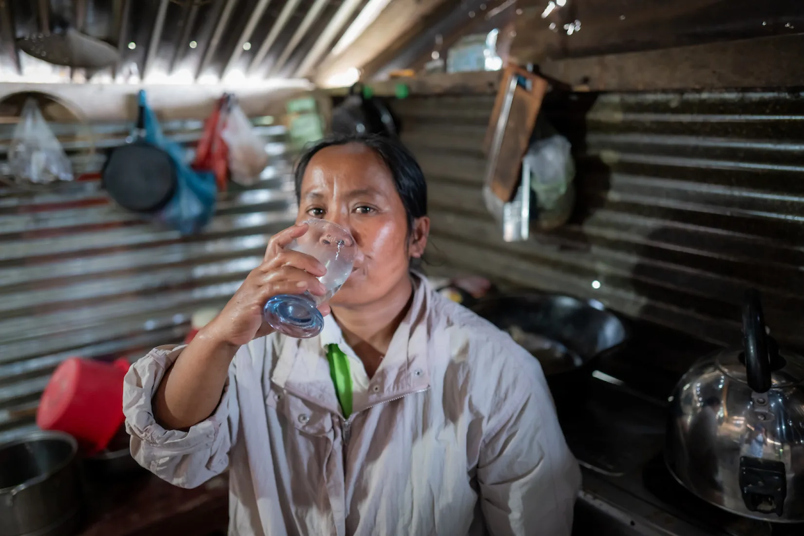 Wantri drinks water from a glass
