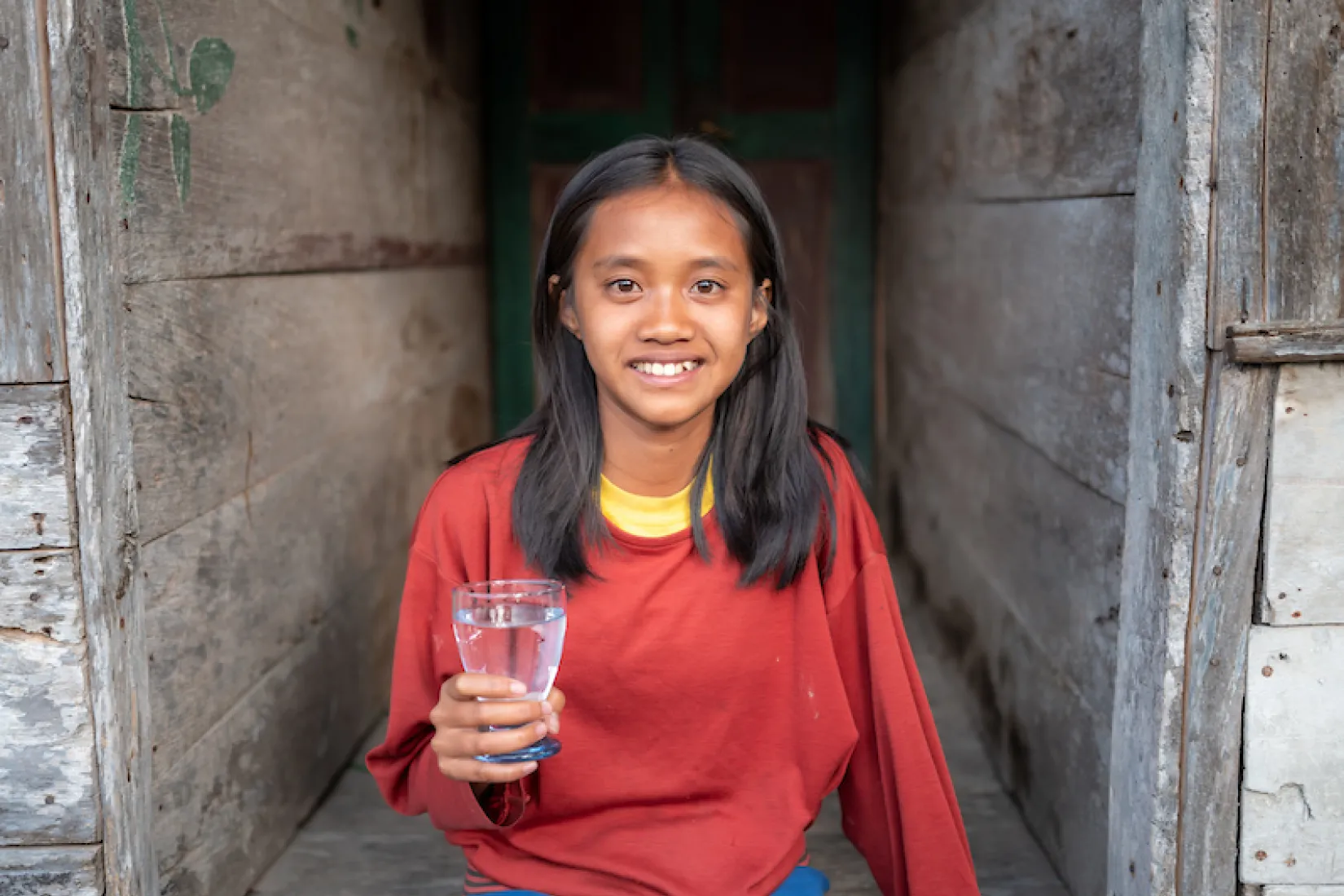 Renatal smiling with glass of water
