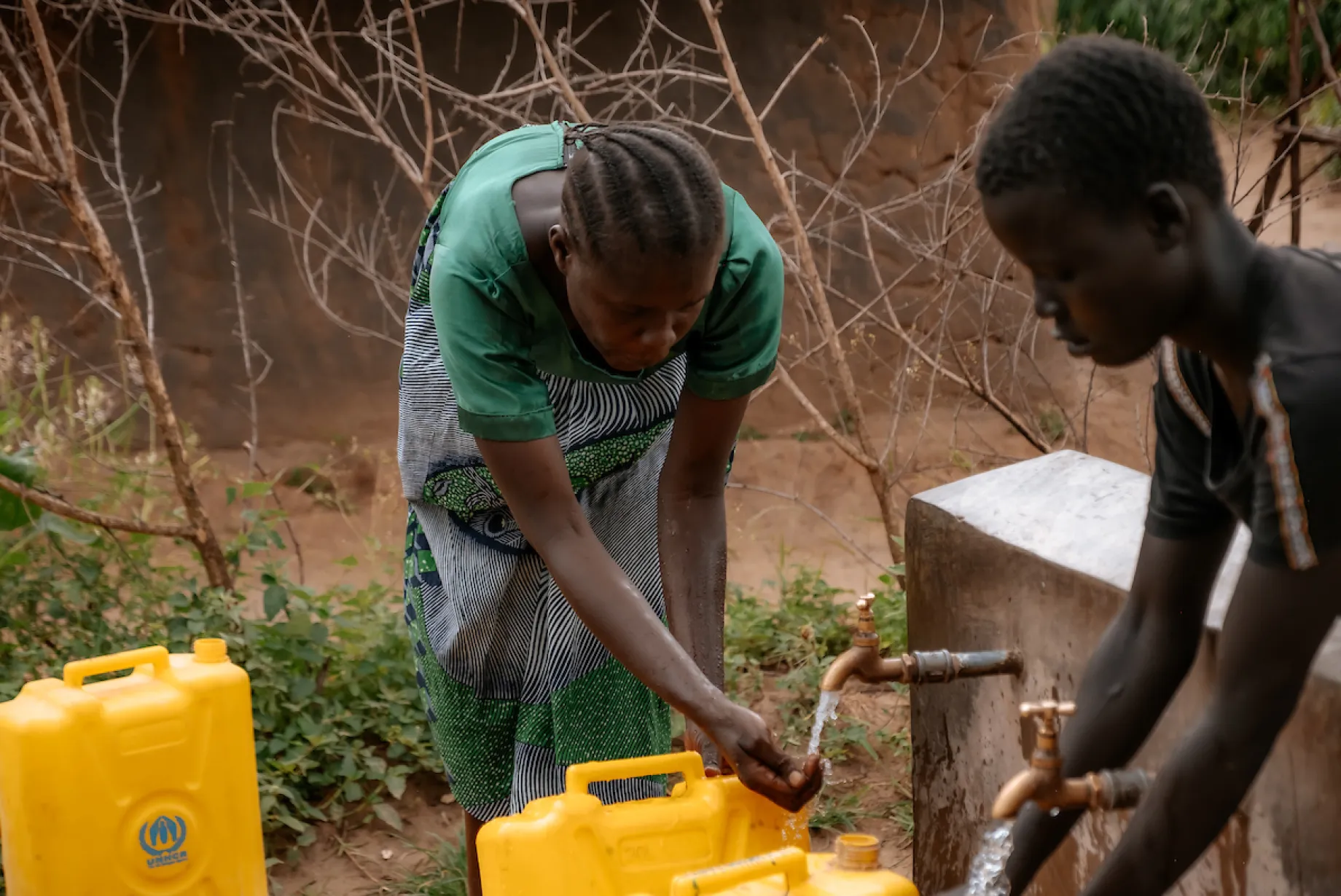 Edina fills up jerry can with water
