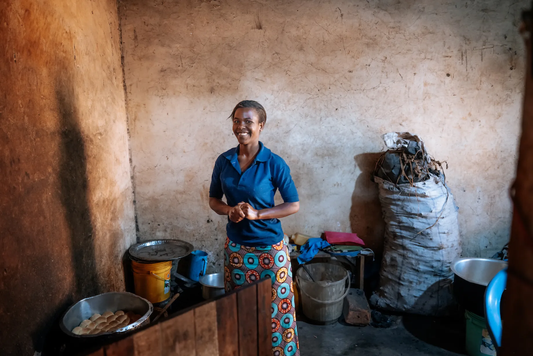Jackline holds cup of safe water