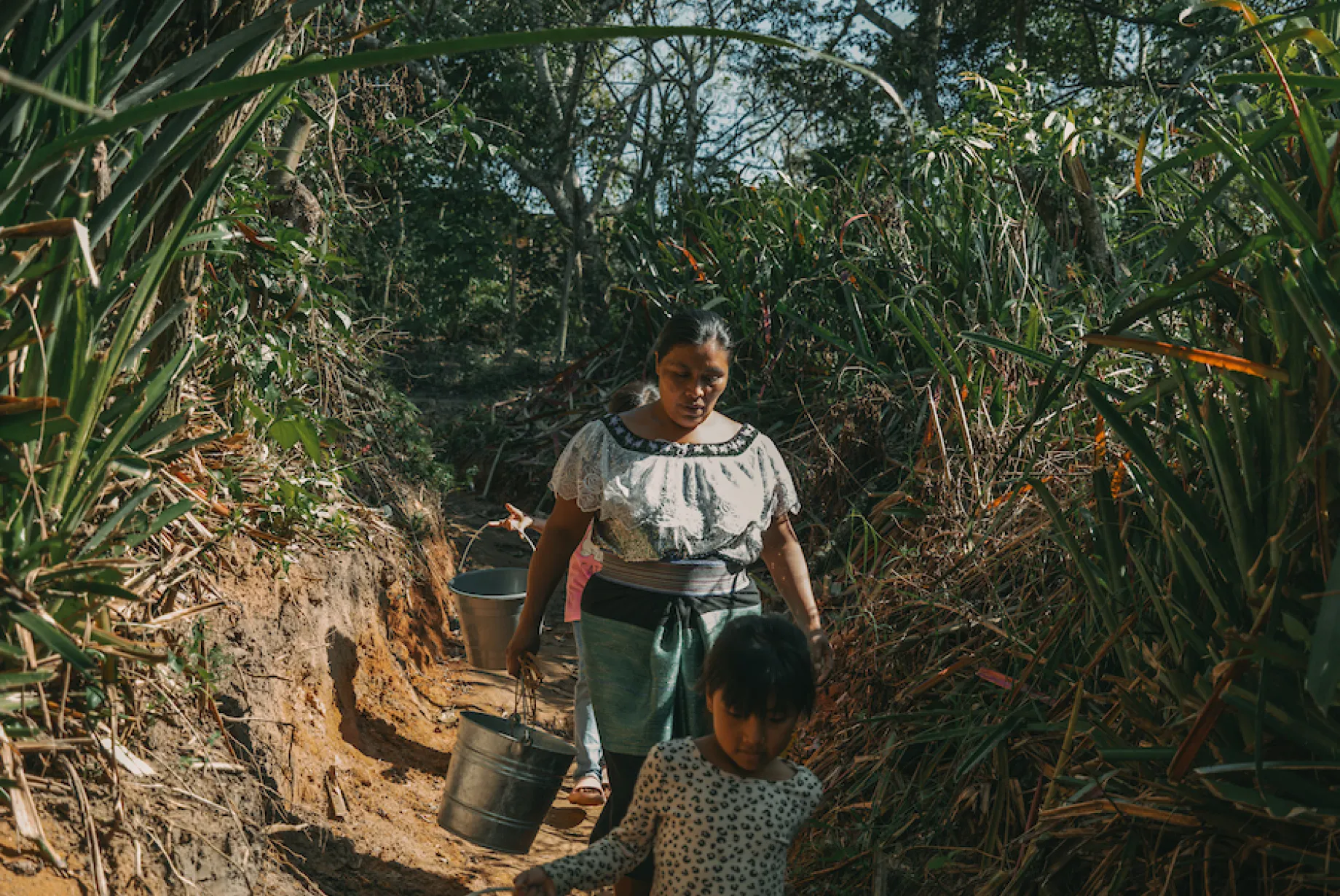 Maria and her children fetch water in Mexico