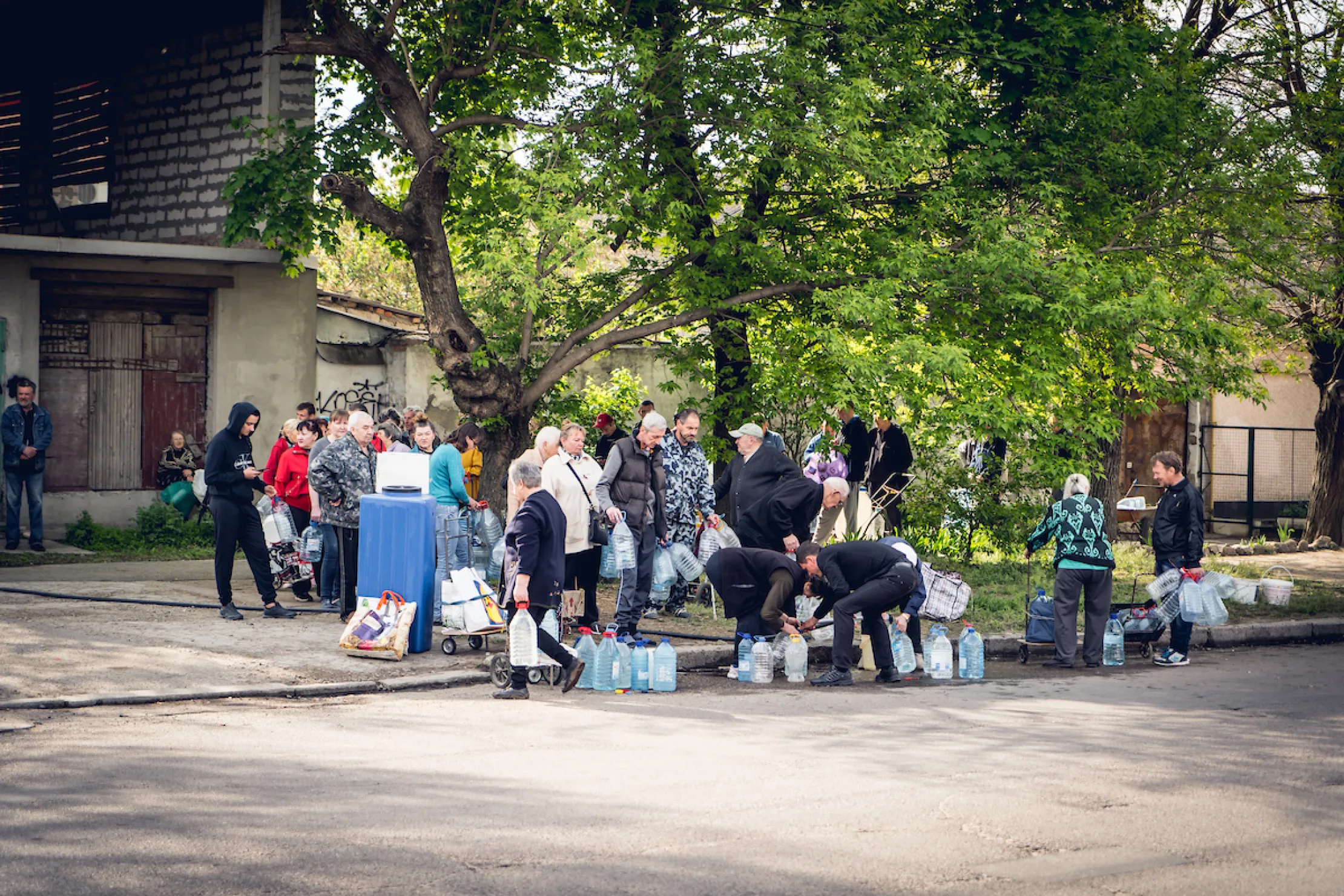 People waiting in line for safe water
