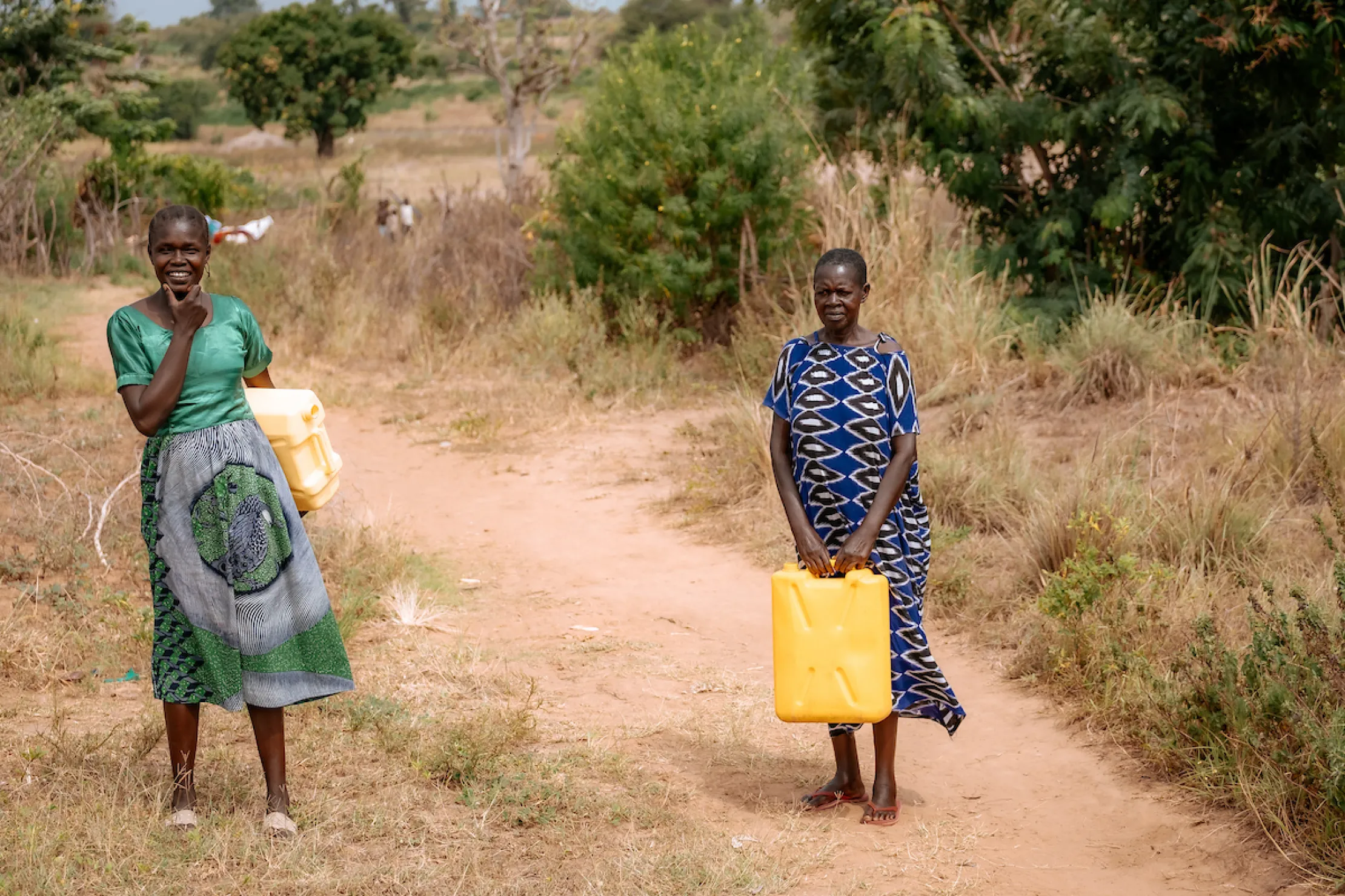 Two women with jerry cans