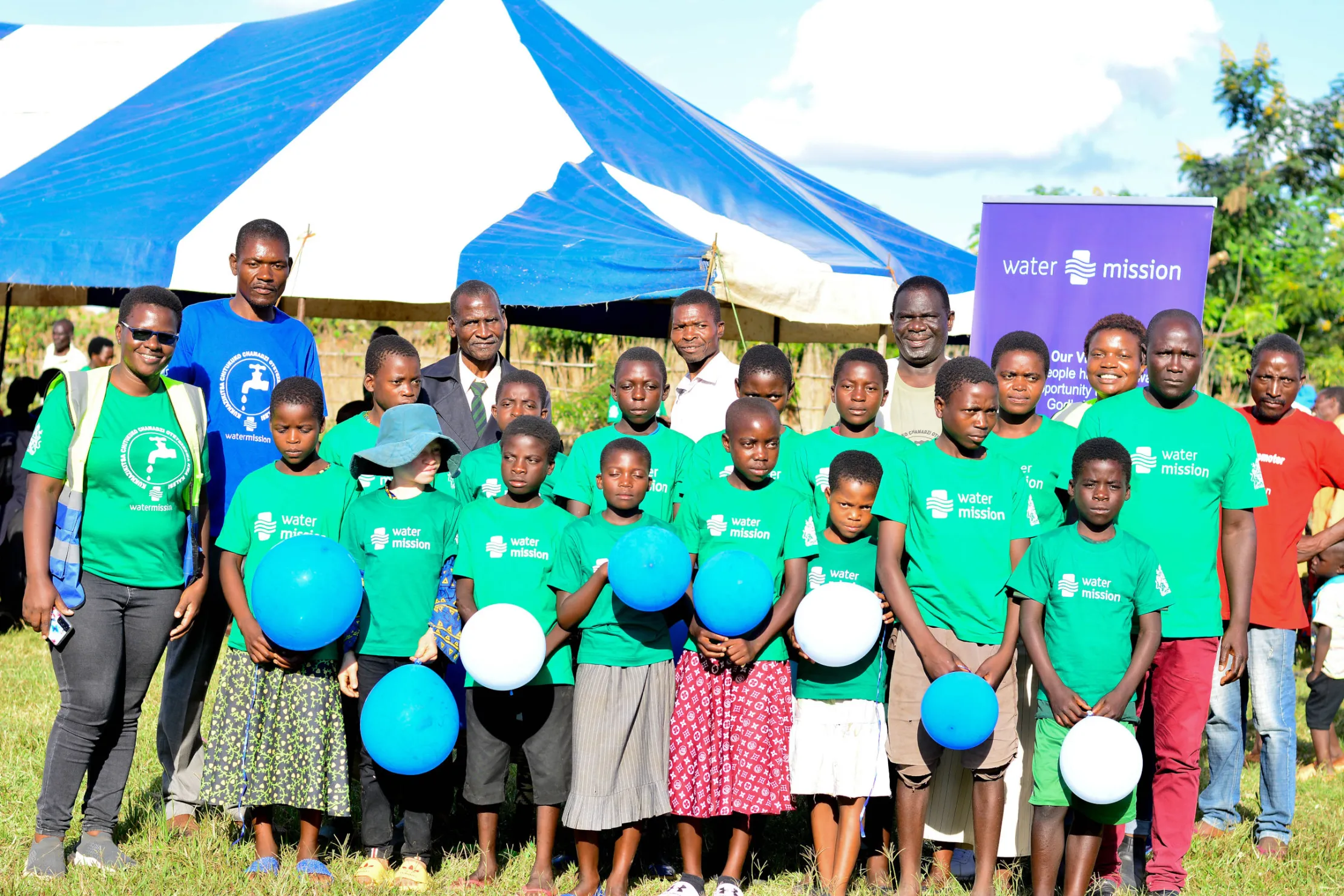Children at a safe water project commissioning ceremony