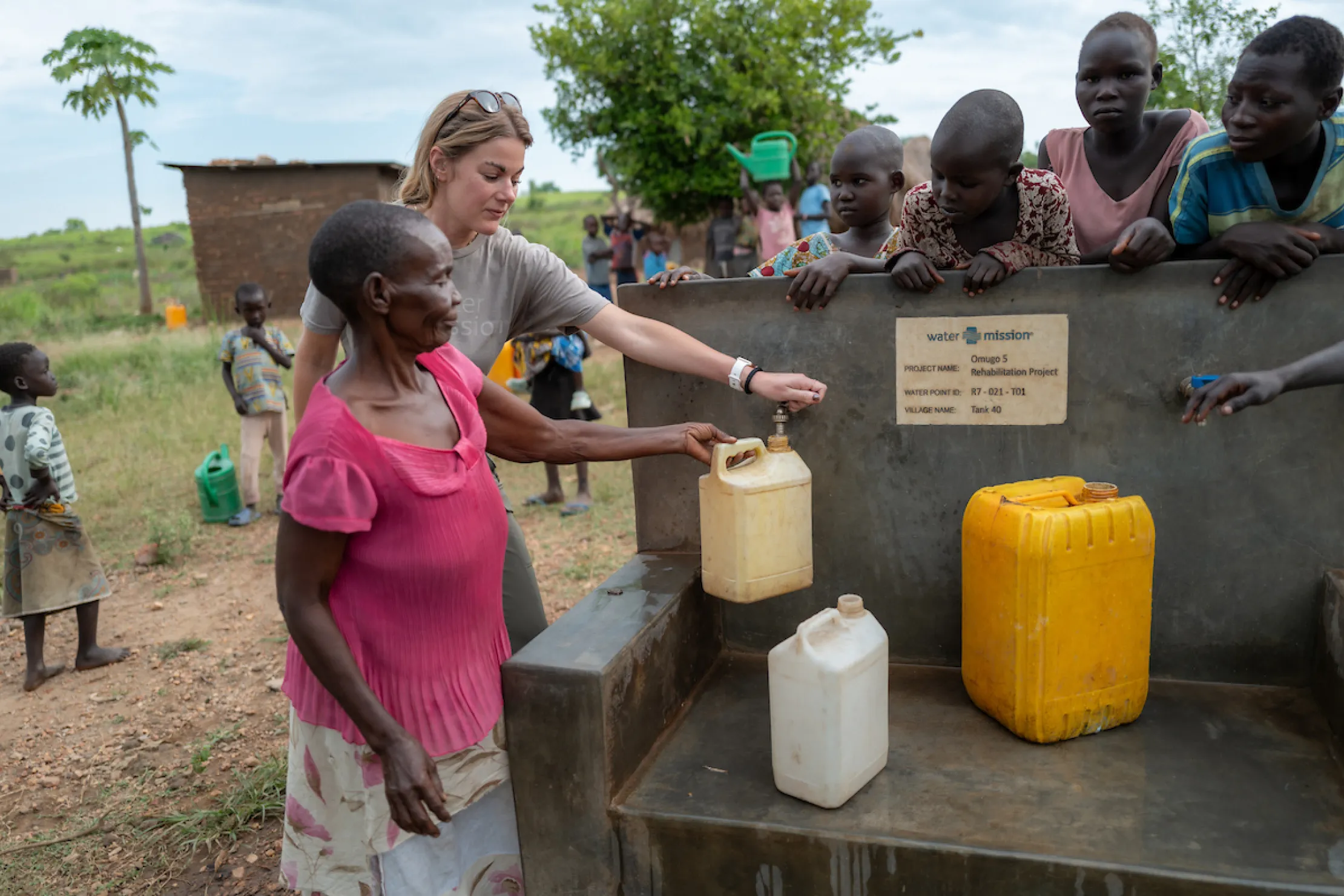 A refugee woman accesses safe water