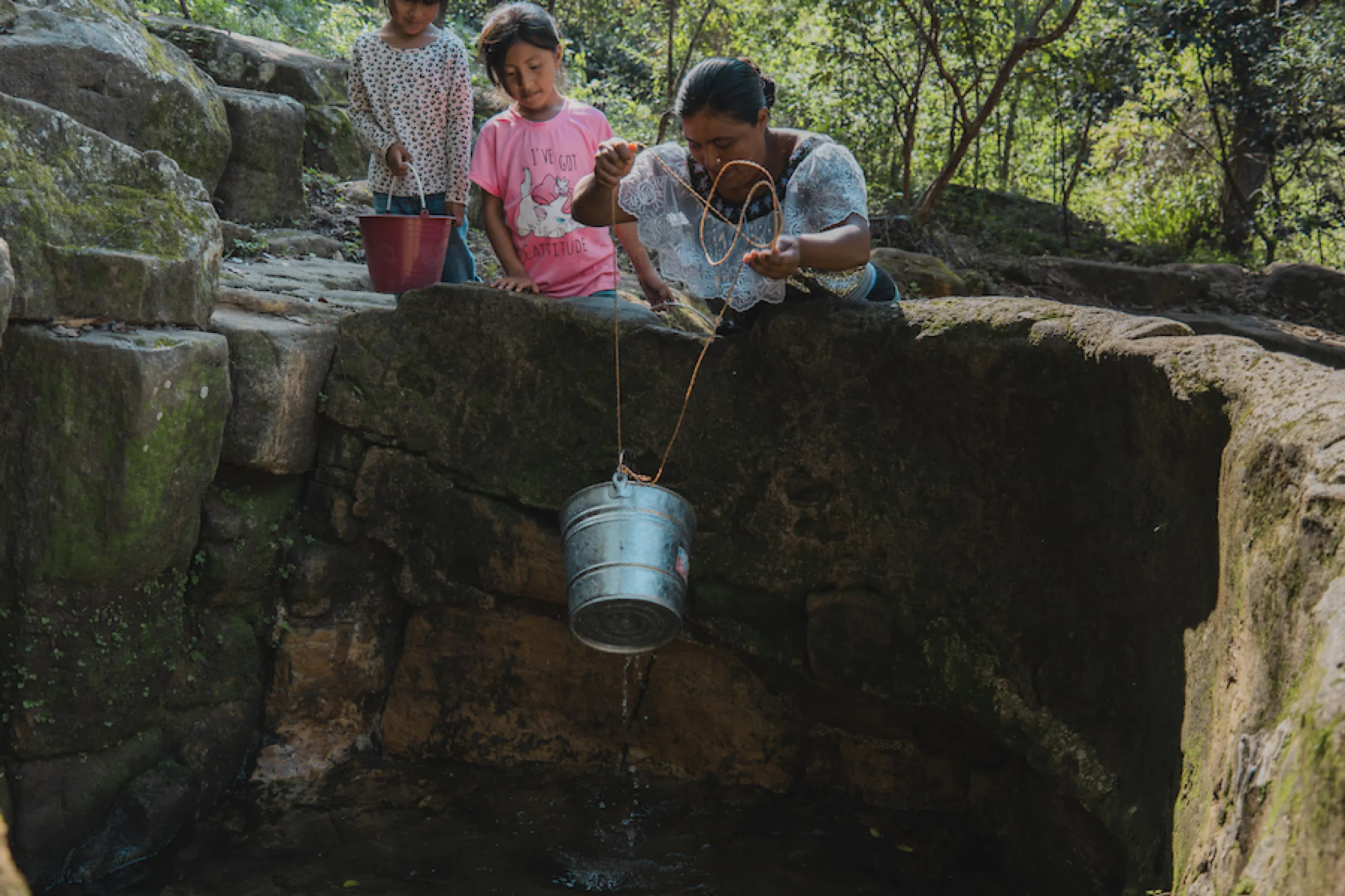 Maria and her children fetch water in Mexico