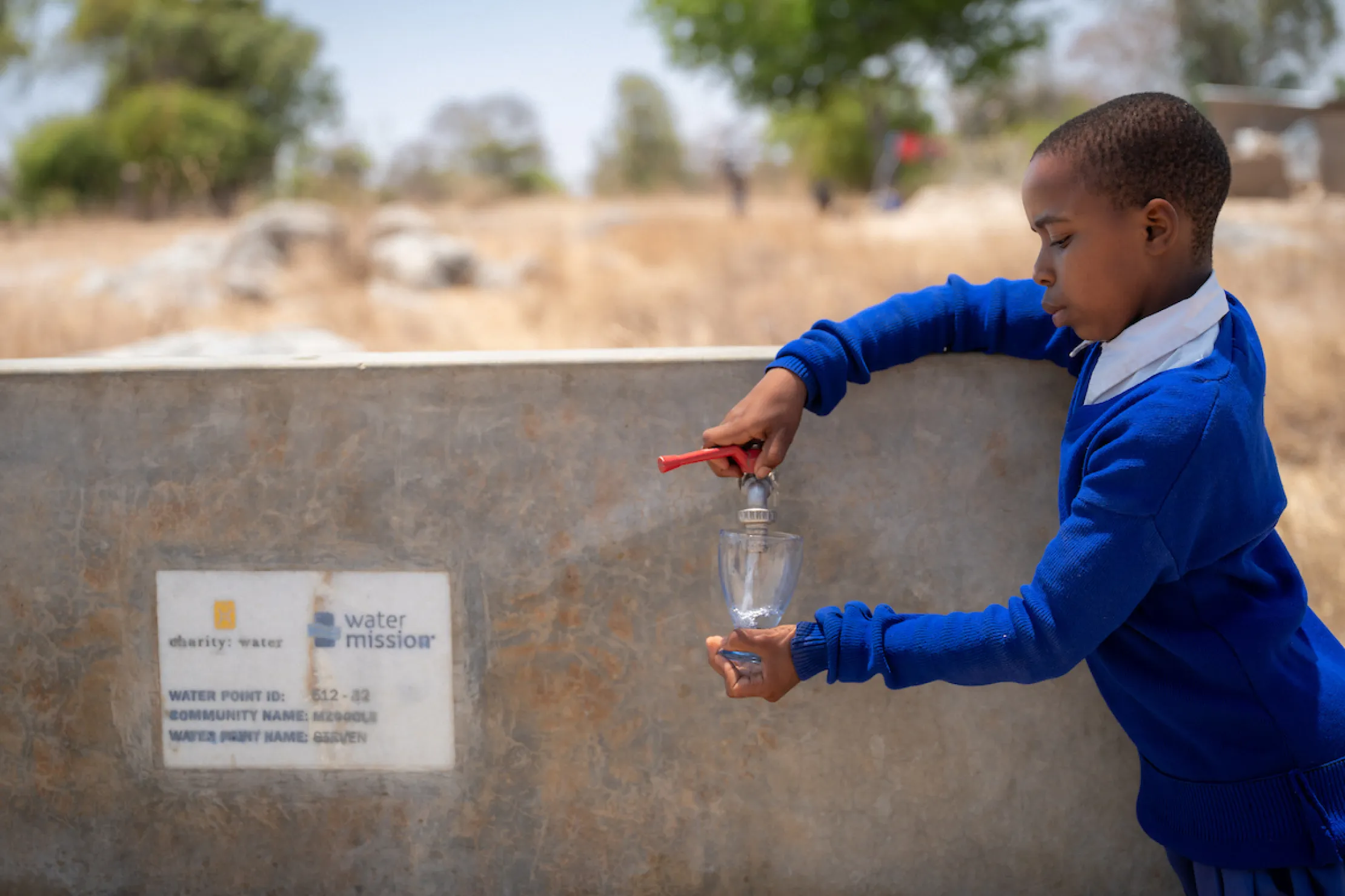 Young girl in Tanzania accesses safe water