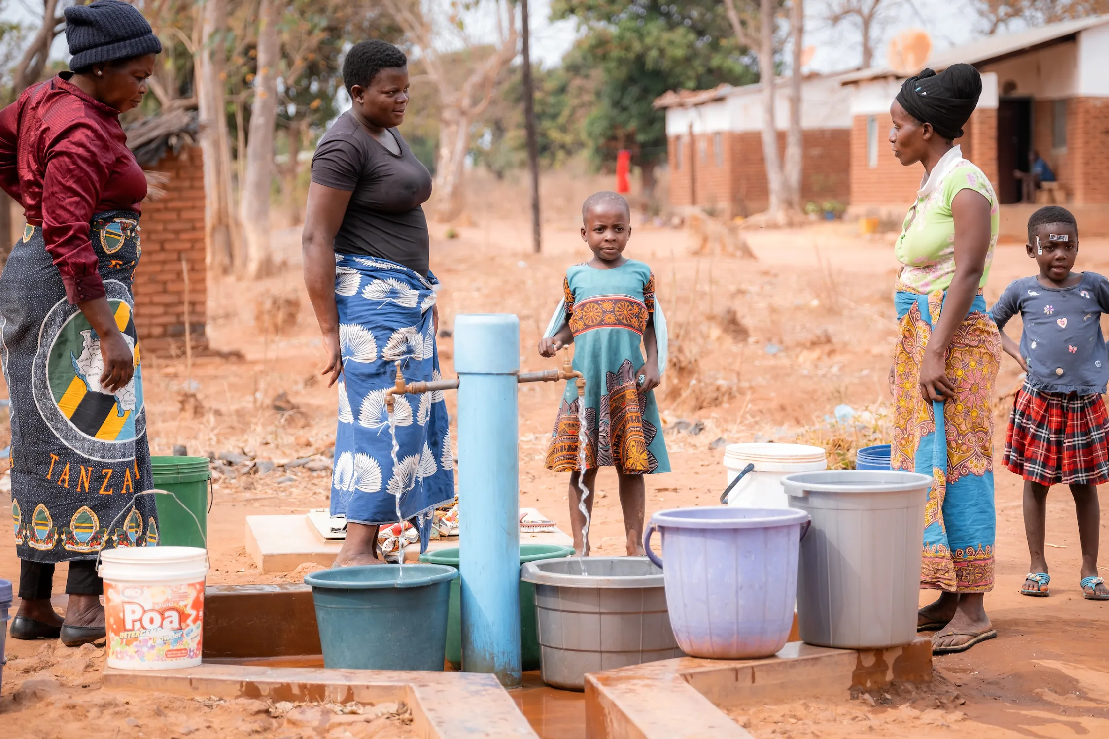 Community members receiving safe water.