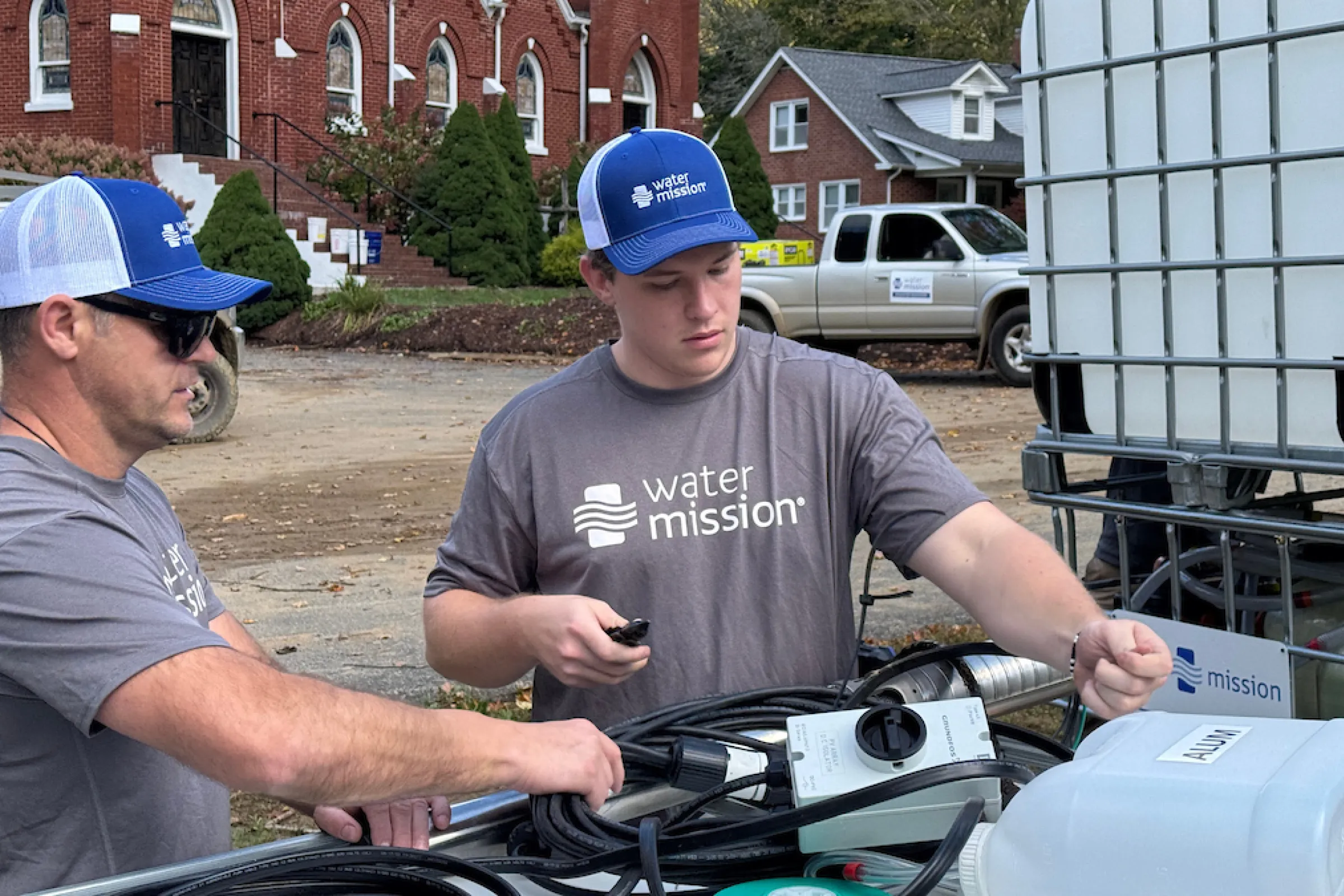 Water Mission volunteers assemble a Living Water Treatment System