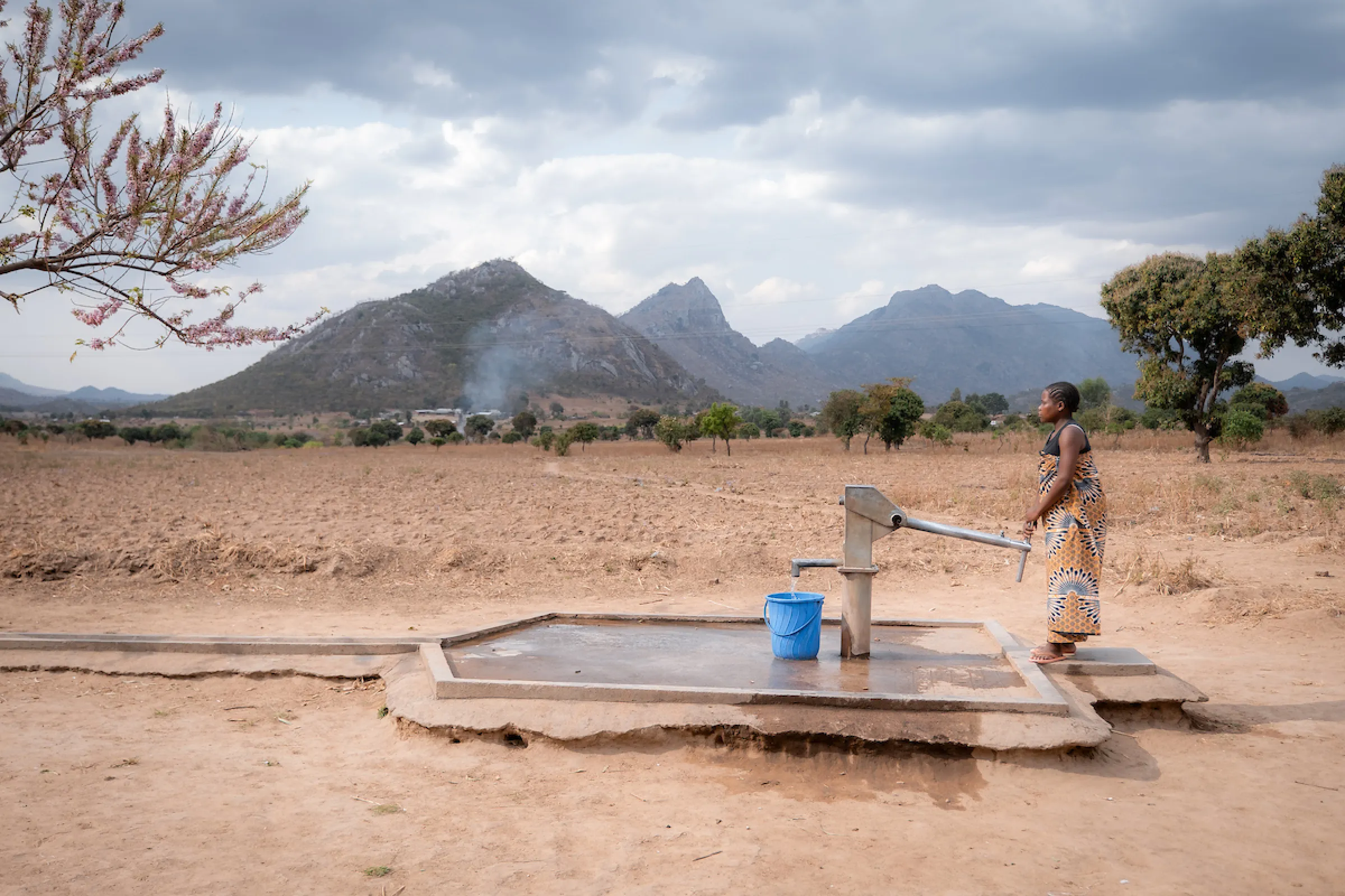 African woman at a water pump