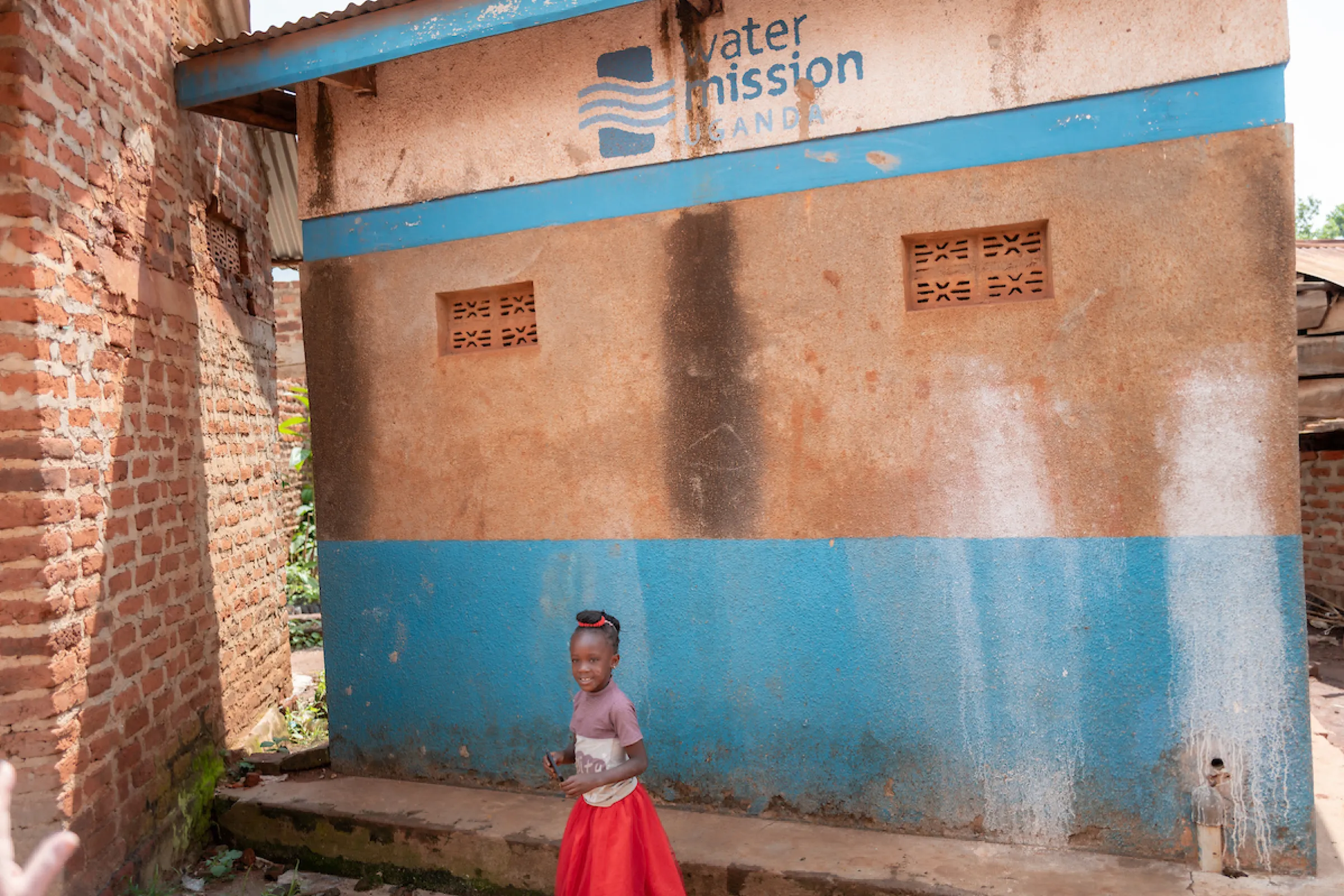 A child drinking safe water in Uganda