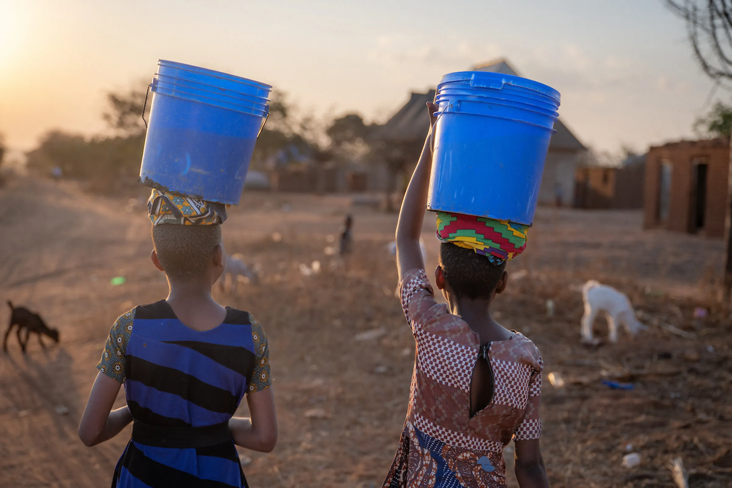 Neema and Recho walk for water in Tanzania, Africa