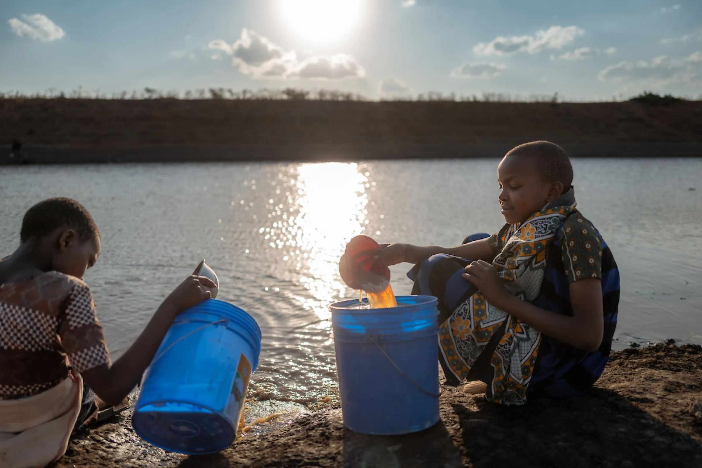 Neema and Recho walk for water in Tanzania, Africa