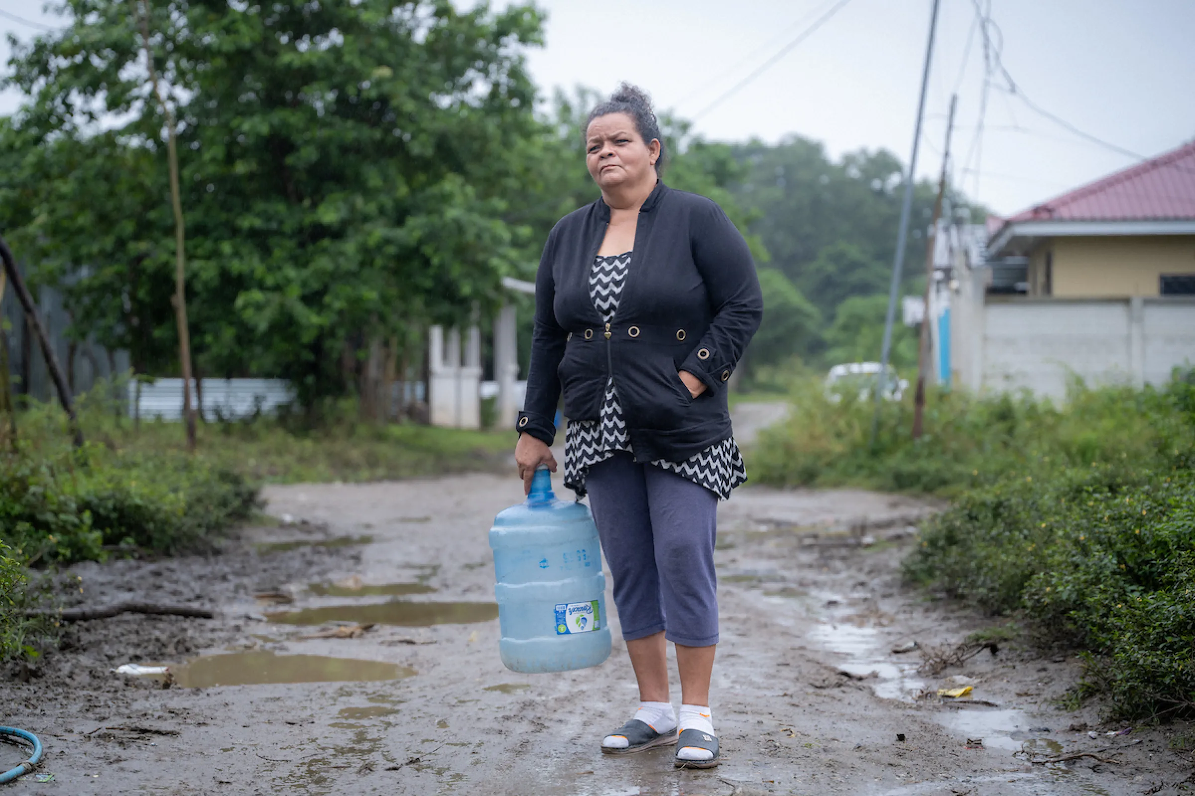 A woman in Honduras with safe water she collected